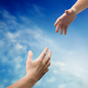 Two hands reaching out to each other