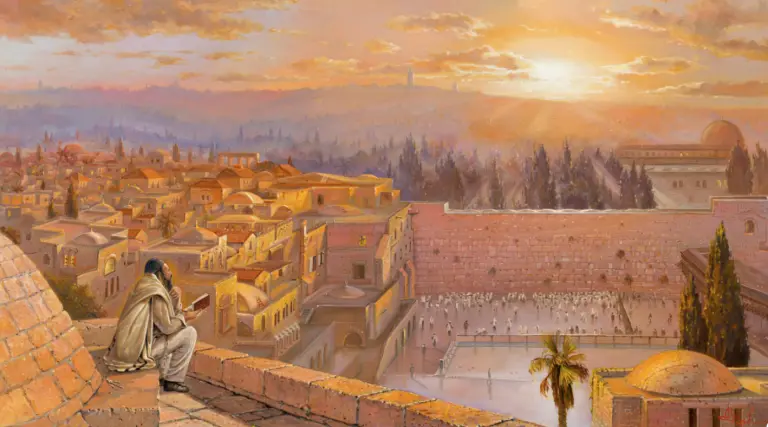 Man davening at a lookout overlooking the Kotel as sun is setting