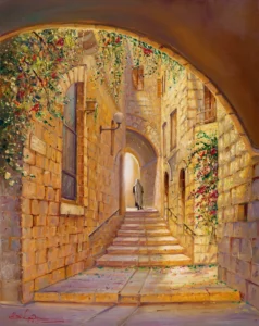 Street in the old city with flowers and vibrant colors and a man walking up stairs painting