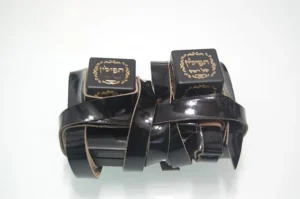A pair of Tefillin on a white surface