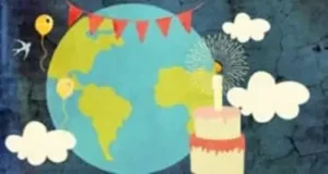 World surrounded by clouds and banner strung up with a birthday cake and a balloon