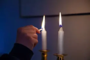 Woman lighting the Shabbat candles