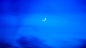 Rosh Chodesh, new moon sliver in a blue sky