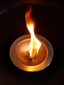 Oil flame surrounded by darkness