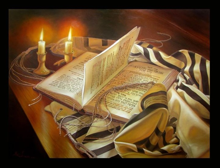 Tallit, Siddur, and Lit candles on a table