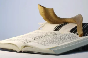 Rosh Hashana- shofar with machzor (prayer book) and tallit