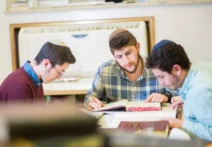 Three yeshiva boys learning Torah together