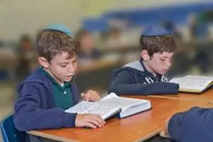 Two young Jewish boys learning Torah together