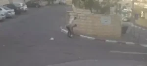 Terrorists dropping the gun that did not work when they planned an attack in Jerusalem