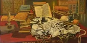 Talit and sefarim spread out on a table